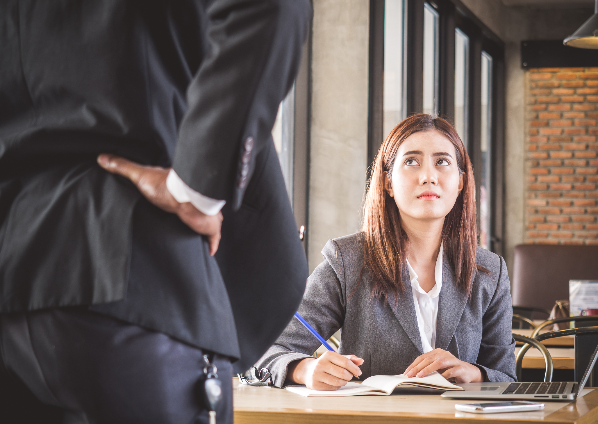 Aggressive/angry boss complaining to female employee